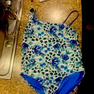 Bathing suit  size is 14/16  brand is wonder nation it does have to be shipped